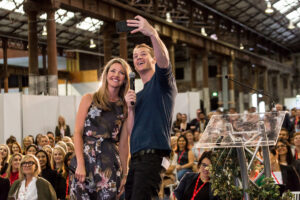 Facebook's Alexandra Sloane taking a selfie with the crowd at Millennial 20/20. Source.