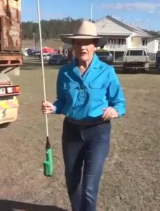 Pauline Hanson in the country wearing blue jeans, a blue shirt and a cowboy hat