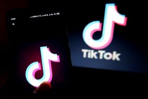 two screens holding up the TikTok logo