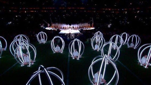 children performing in cages at the super bowl