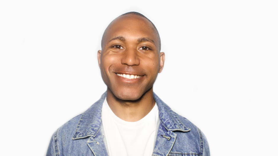 picture of an adopted man smiling with a white background