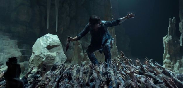 Photo of man atop zombies from the walking dead on Binge