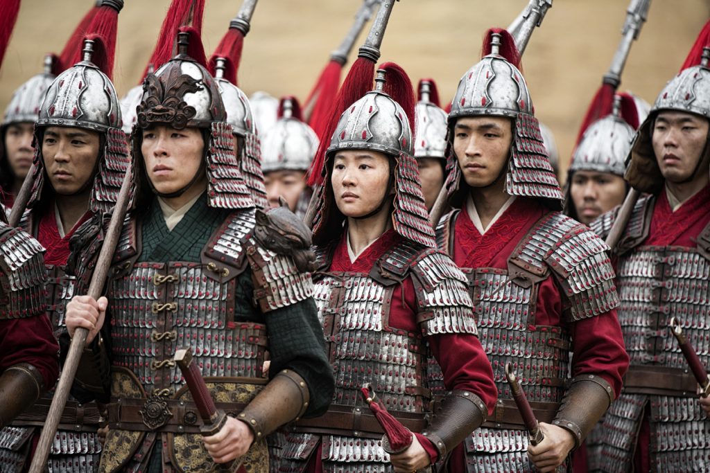 Mulan marching with soldiers in battle