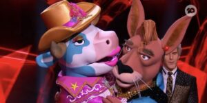 Cowgirl and Bouncer hug on The Masked Singer