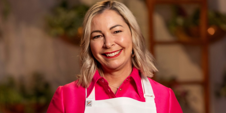 Rhiannon Anderson smiles in a hot pink shirt and white apron on MasterChef Australia 2025