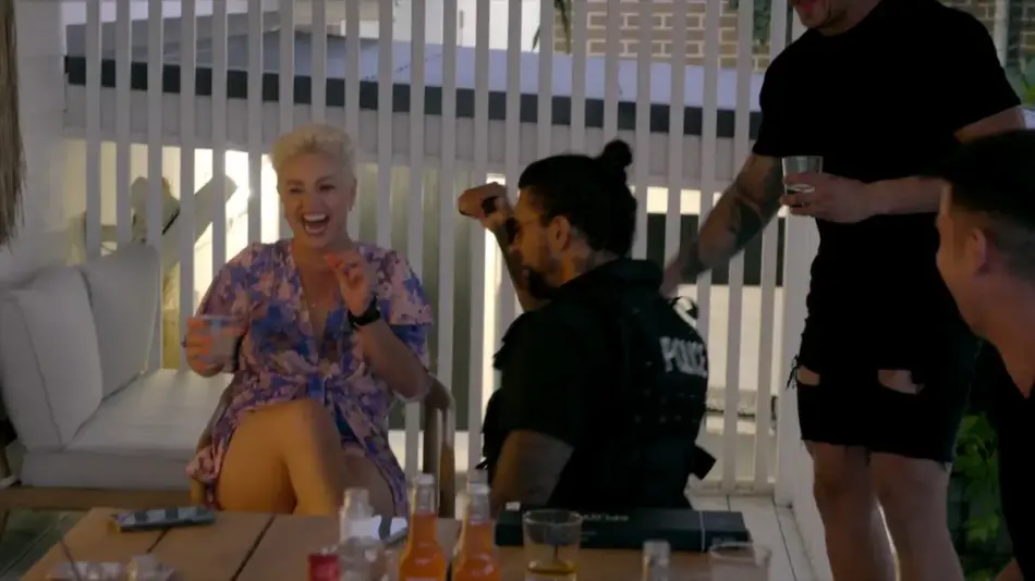 Jay in a cop uniform stripping on Billion Dollar Playground