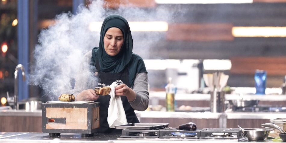 Samira cooking his chicken on the hibachi.