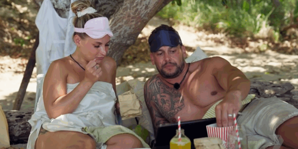 Amy and Mike on Stranded On Honeymoon Island watching man bun Haydn Slater