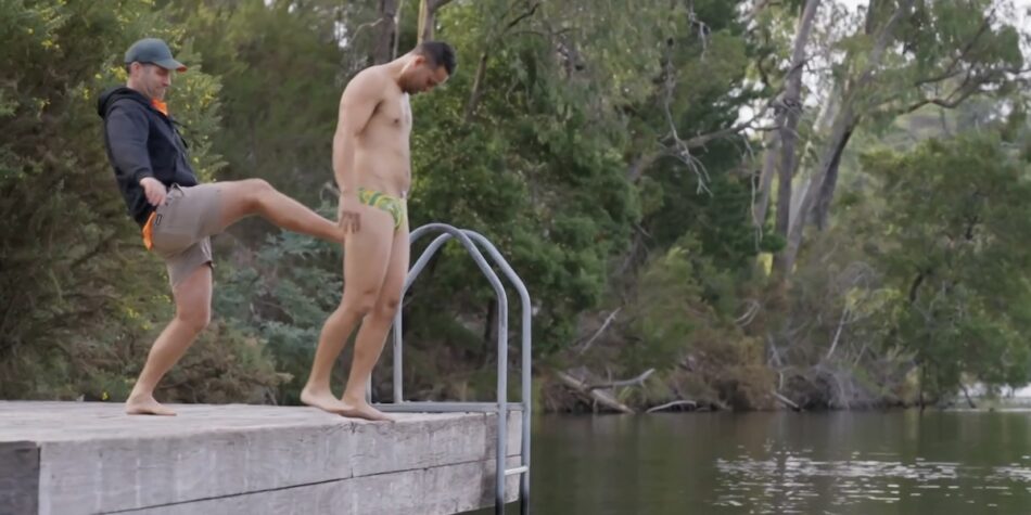 Foreman Dan booting Taz into the water after a lost dare. 