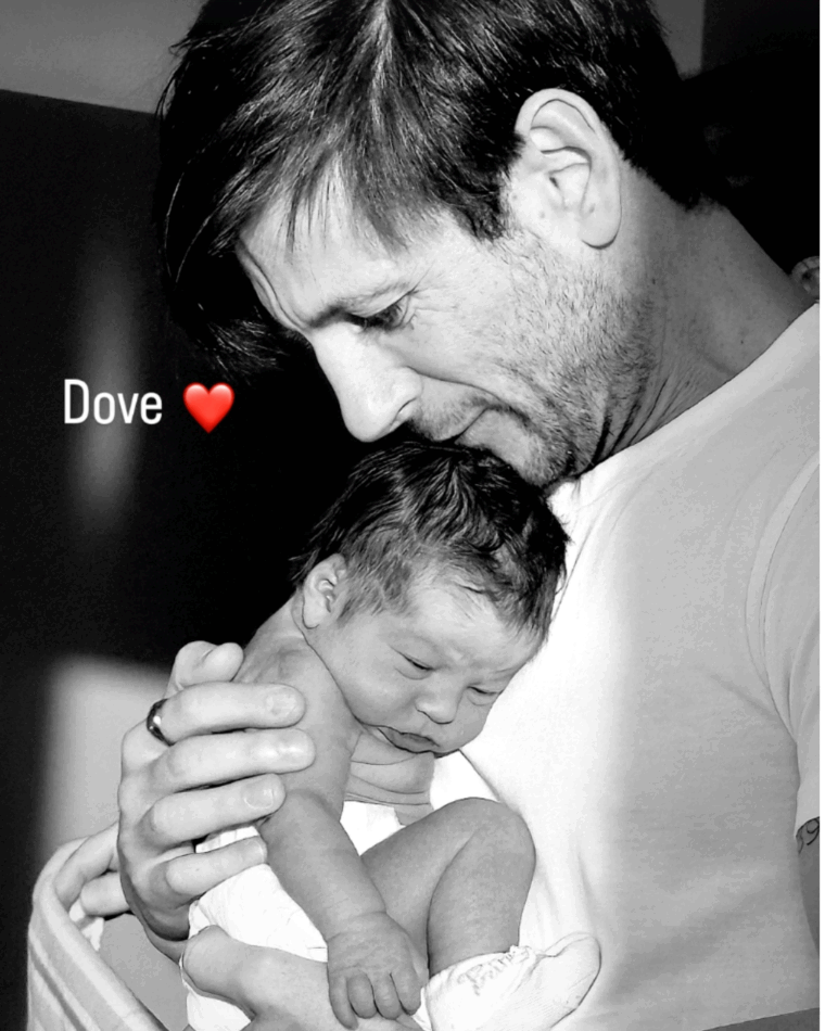 Black and white photo of Jarod pictured with baby Dove, his daughter with MAFS' Dom