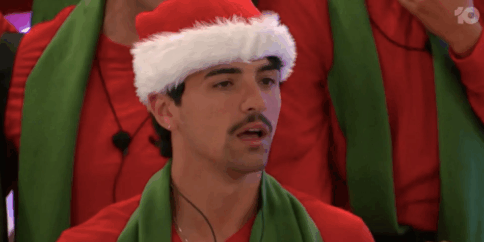 Vinnie on Big Brother Australia wearing a santa hat during his snap eviction.
