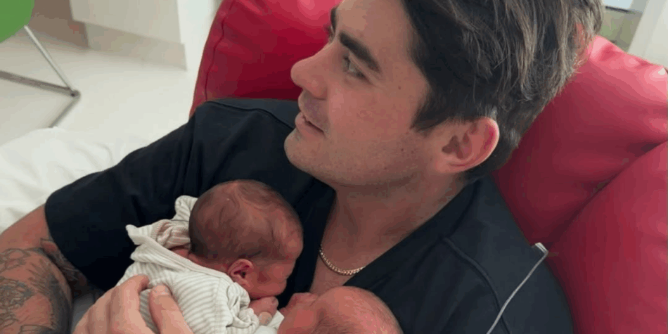 Declan Cleary with his twin baby girls Claudia and Charlotte.