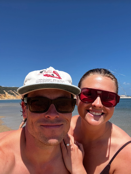 Home and Away stars Patrick O'Connor and Sophie Dillman with engagement ring at the beach