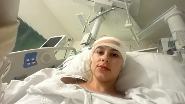 Home and Away's Alea O'Shea takes a selfie while lying in a hospital bed